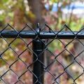 Black vinyl coated chain link fence used for public infrastructure