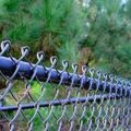 Black vinyl coated chain link fence used for public infrastructure