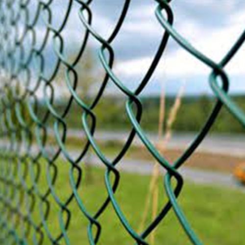 Green vinyl coated chain link fence with sports facilities