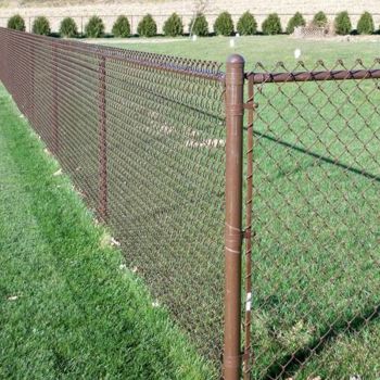 Brown vinyl coated chain link fence with wooden structures