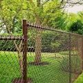 Brown vinyl coated chain link fence with wooden structures